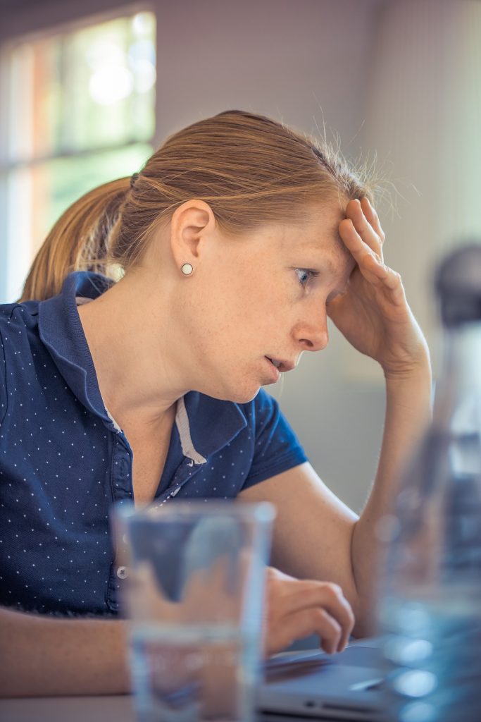 lady looking tired and anxious