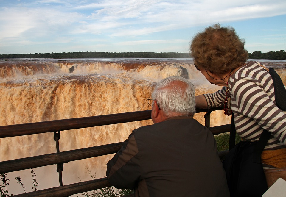 Man and lady looking at a view.