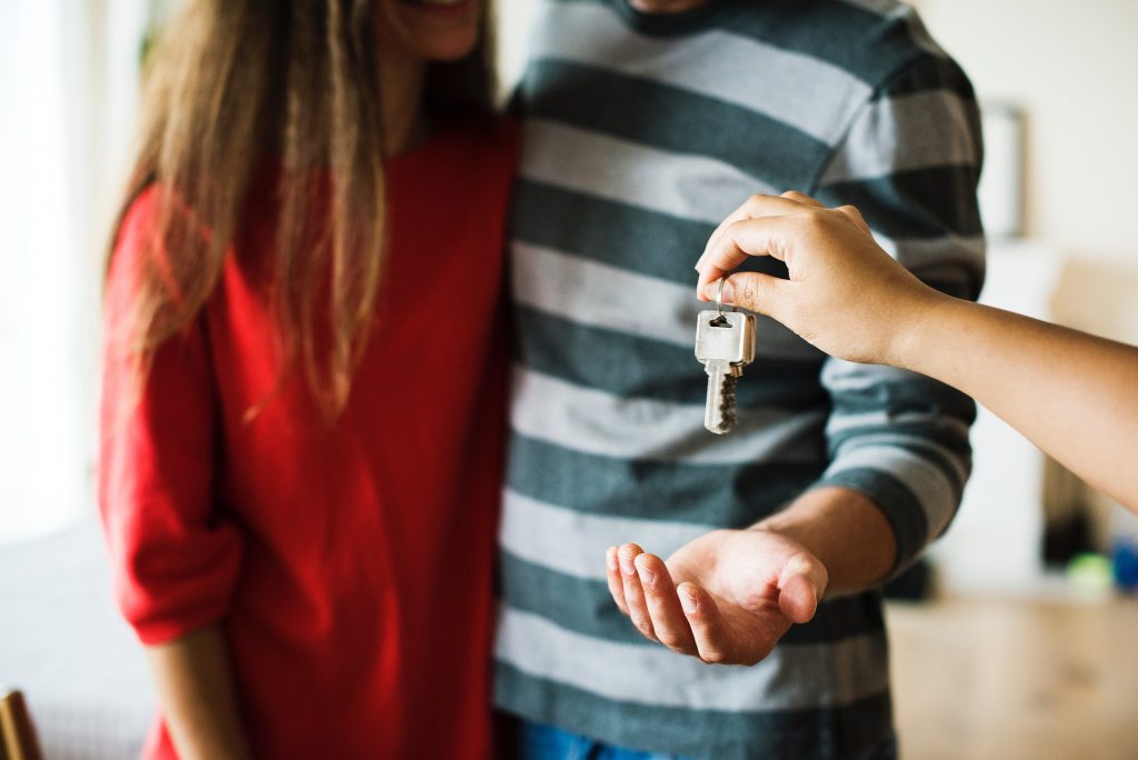 couple being given some house keys