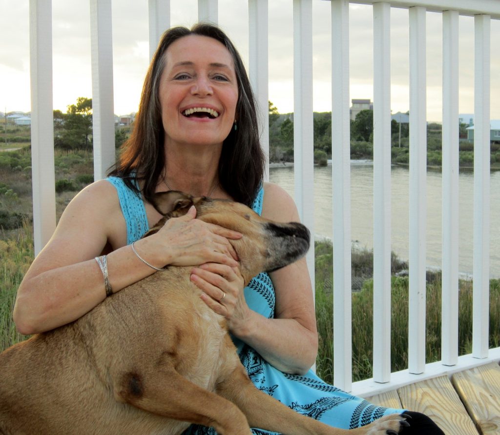 lady cuddling a dog