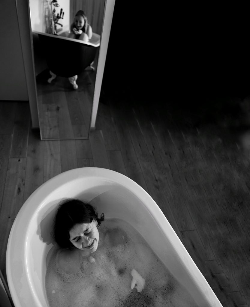lady in bath crying