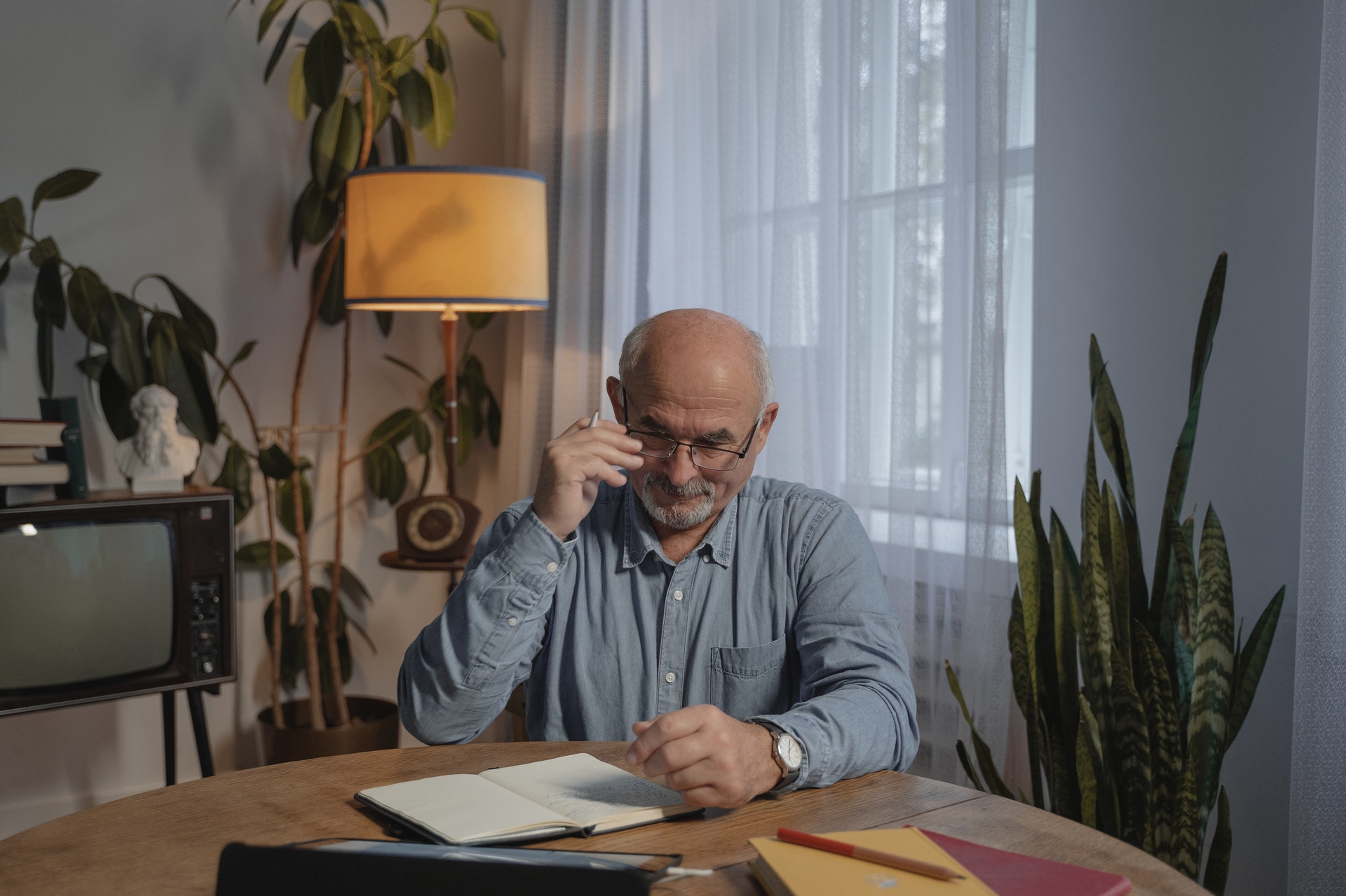 mature man sitting at a desk