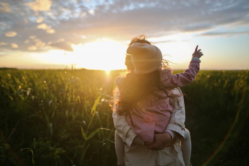 Lady holding a child. 