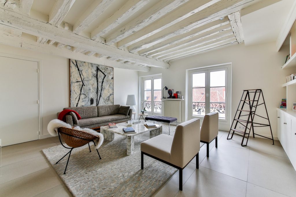Living room with sofas and chairs.